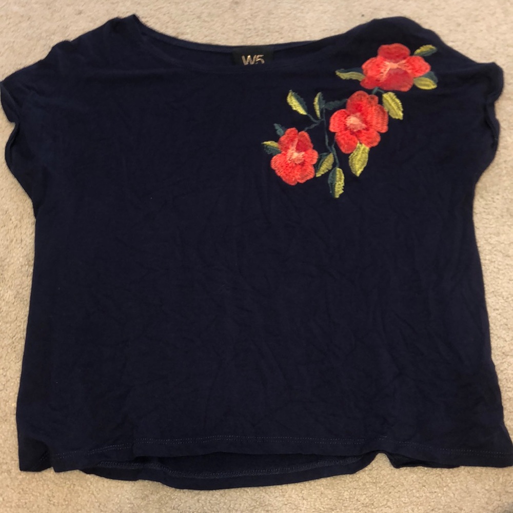 Navy t-shirt with floral pattern on shoulder